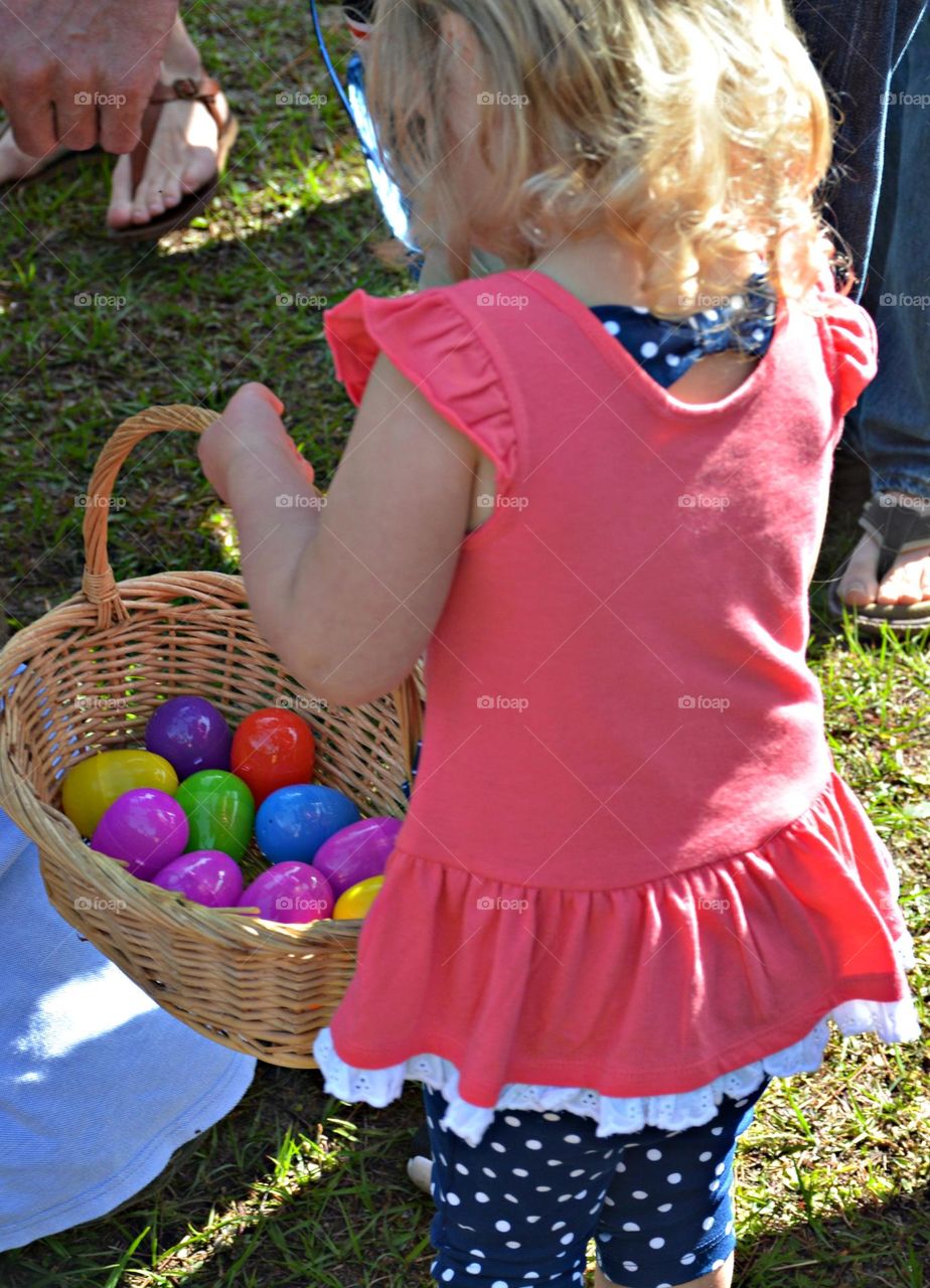 This is spring! Basket full of colorful plastic eggs. What better time to showcase spring than to have an Easter egg hunt