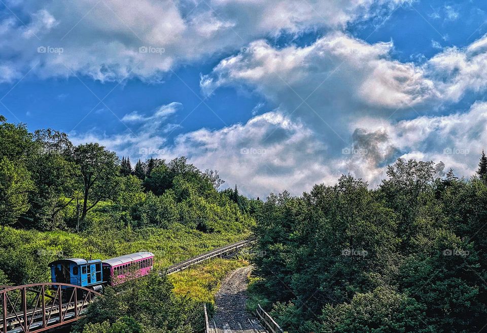 On the mountain side of New Hampshire, riding the rails in New Hampshire, fun trips in New Hampshire, into the clouds they go