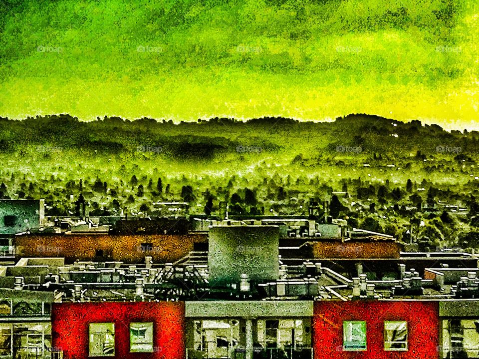 City view from heights, edge with green hills, fog, building tops