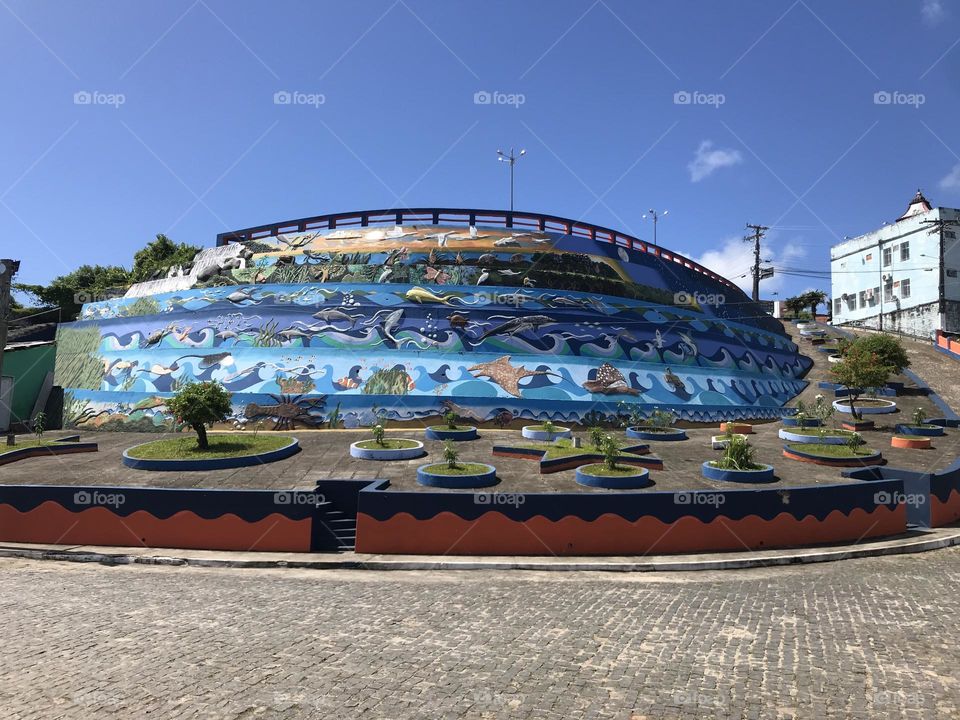 mural painted on a slope in the city of Marau, Bahia, Brazil