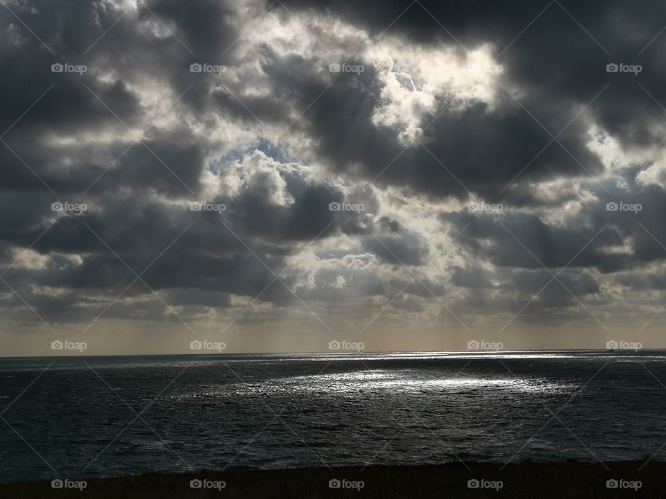 Sunlight coming through the clouds on the British coast