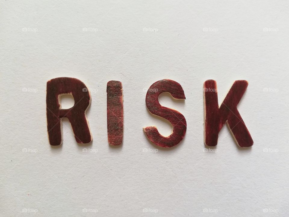 Written :"risk"