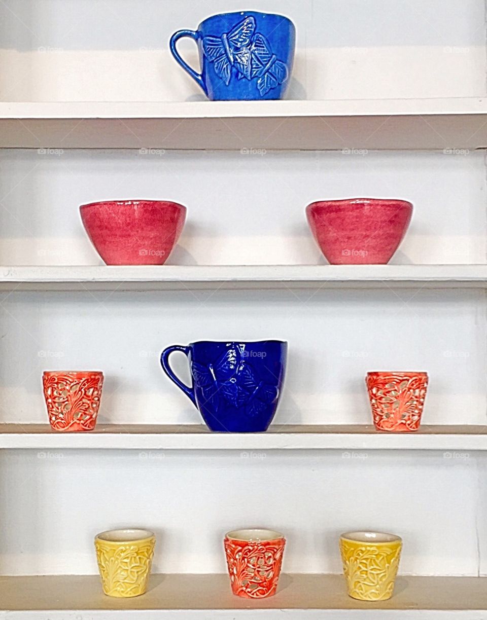 Colourful cups on display 