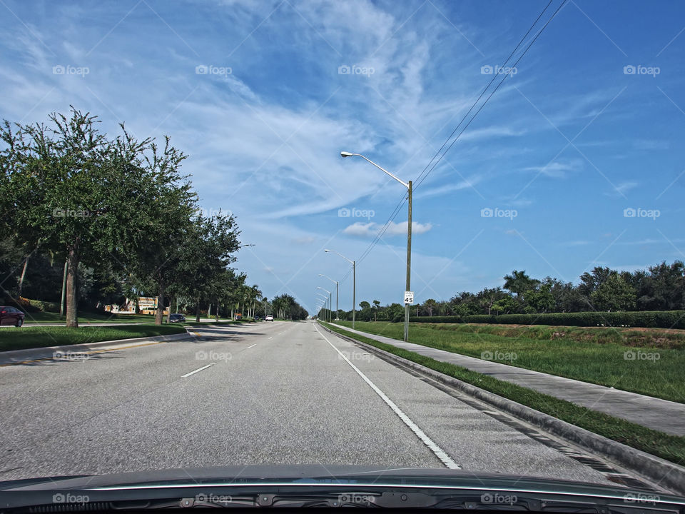 Open Road Blue Skies. Traveling for morning commute on open road with blue skies