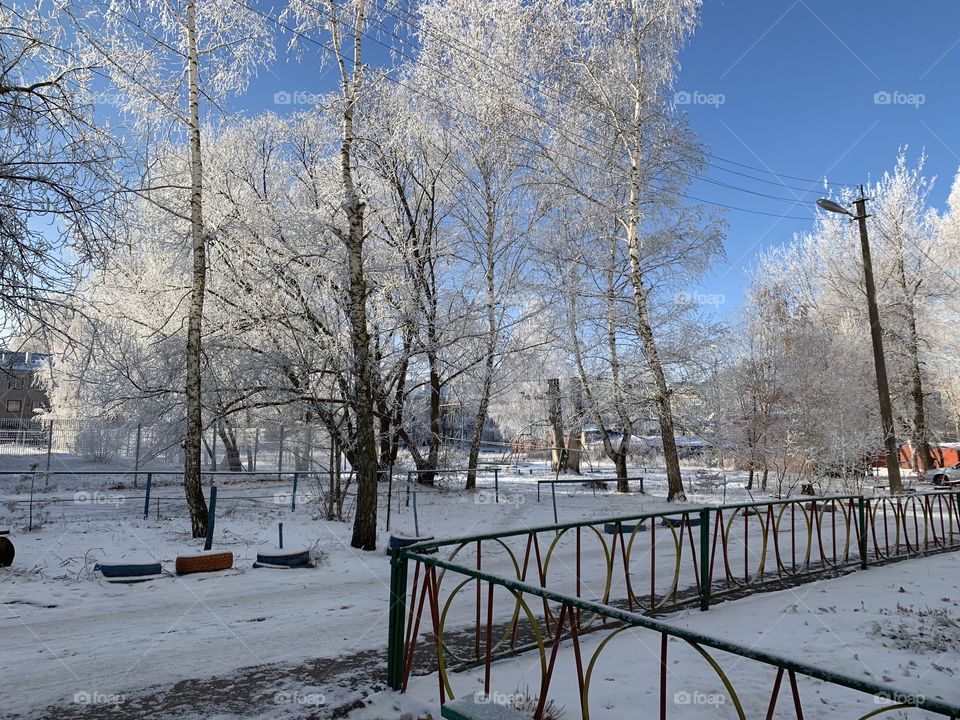 snowy street in the city on the first day of winter