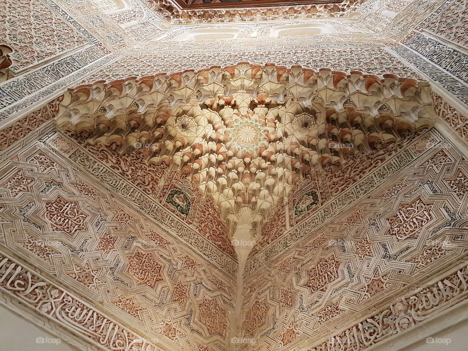 Beautiful muqarnas in a room of the Palacio de la Madraza, Granada, Spain.