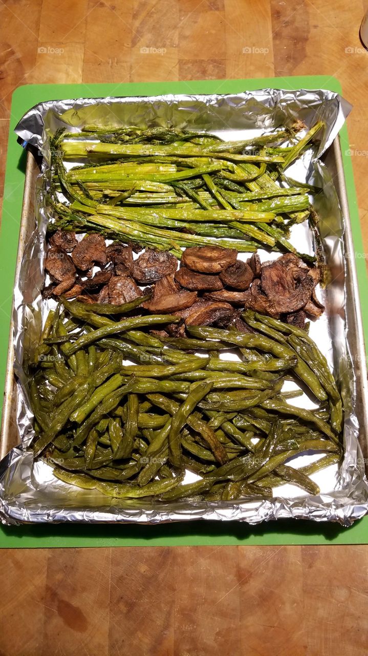 Baked vegetables as they came out of oven. String beans, mushrooms & asparagus for healthy eating, vegetarians.