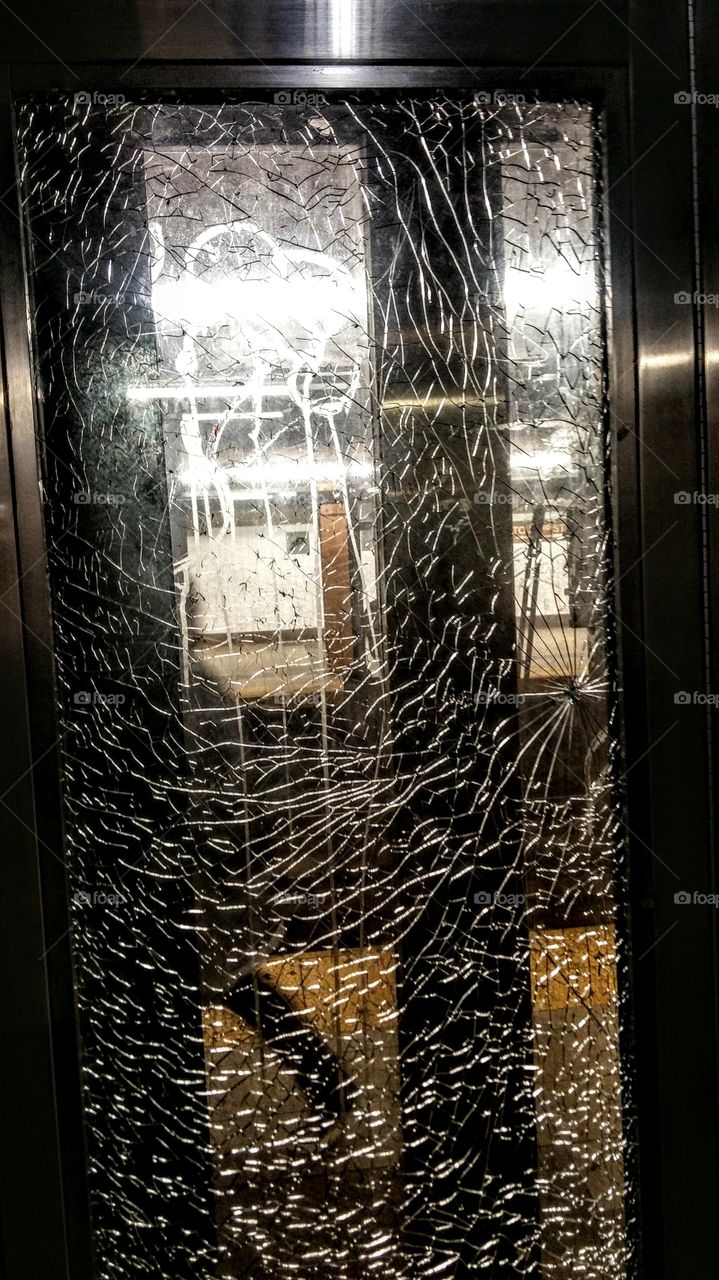 cracked elevator glass