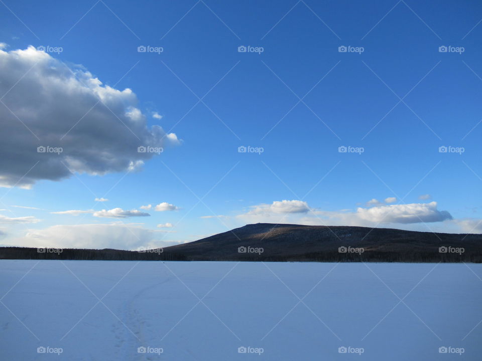 Kachkanar mountain in the Urals in Russia, March, spring, cold, blue