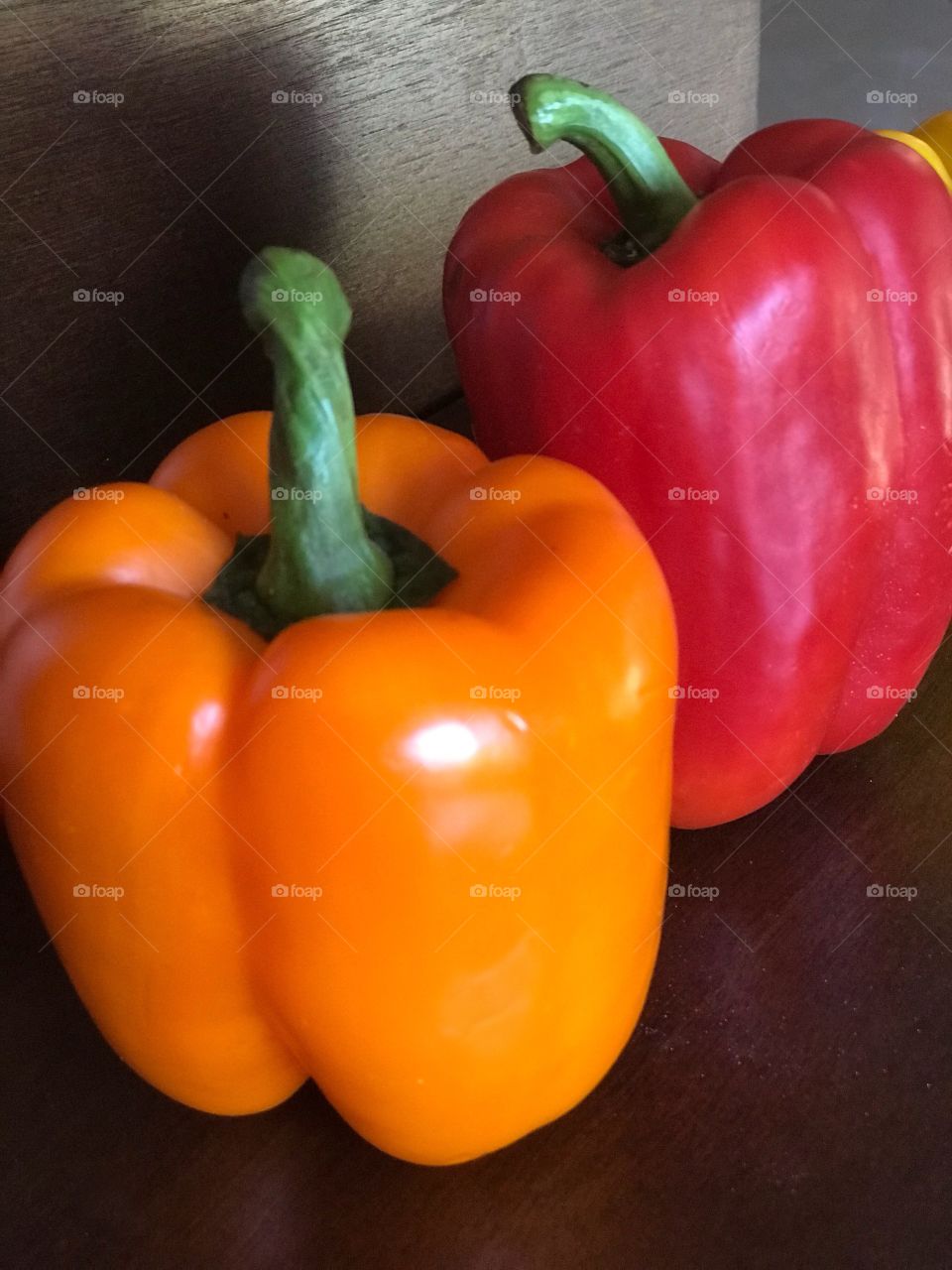 Yellow and red bell peppers on display 