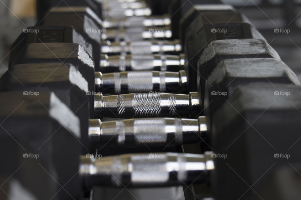 Set of black dumbbell .  weight training equipment concept