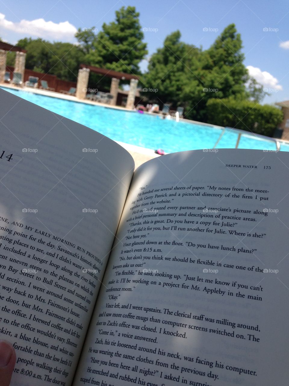 A little R & R. Reading a book by the pool