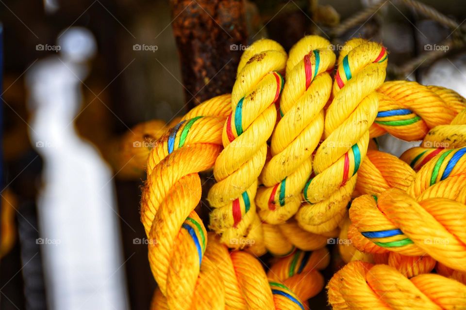 yellow rope tied on crab cage