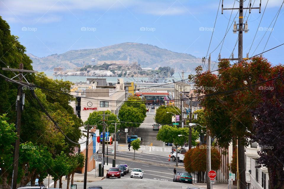 Streets of San Francisco with "the Rock" or Alcatraz in the background 