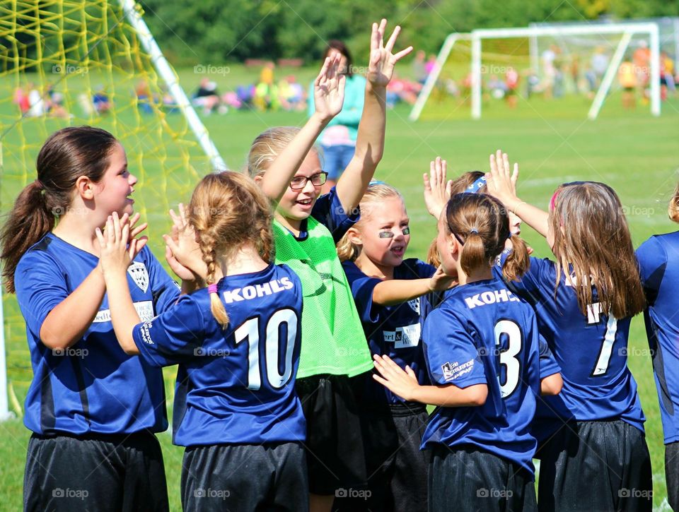 Girls Soccer Celebrating . Girls team celebrates a soccer win 