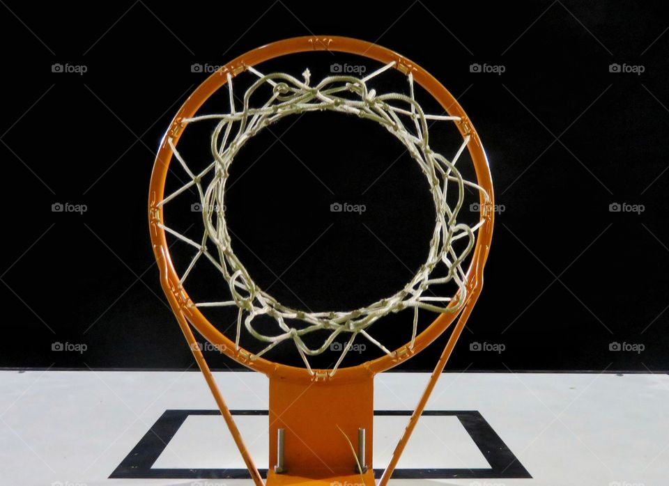 basketball rim by night view from below