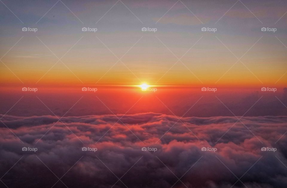 Beautiful sunrise over cloudy scene