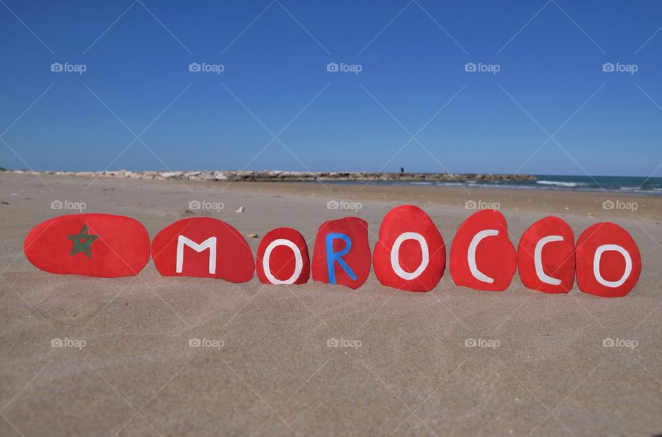 Morocco, souvenir on stones with beach background