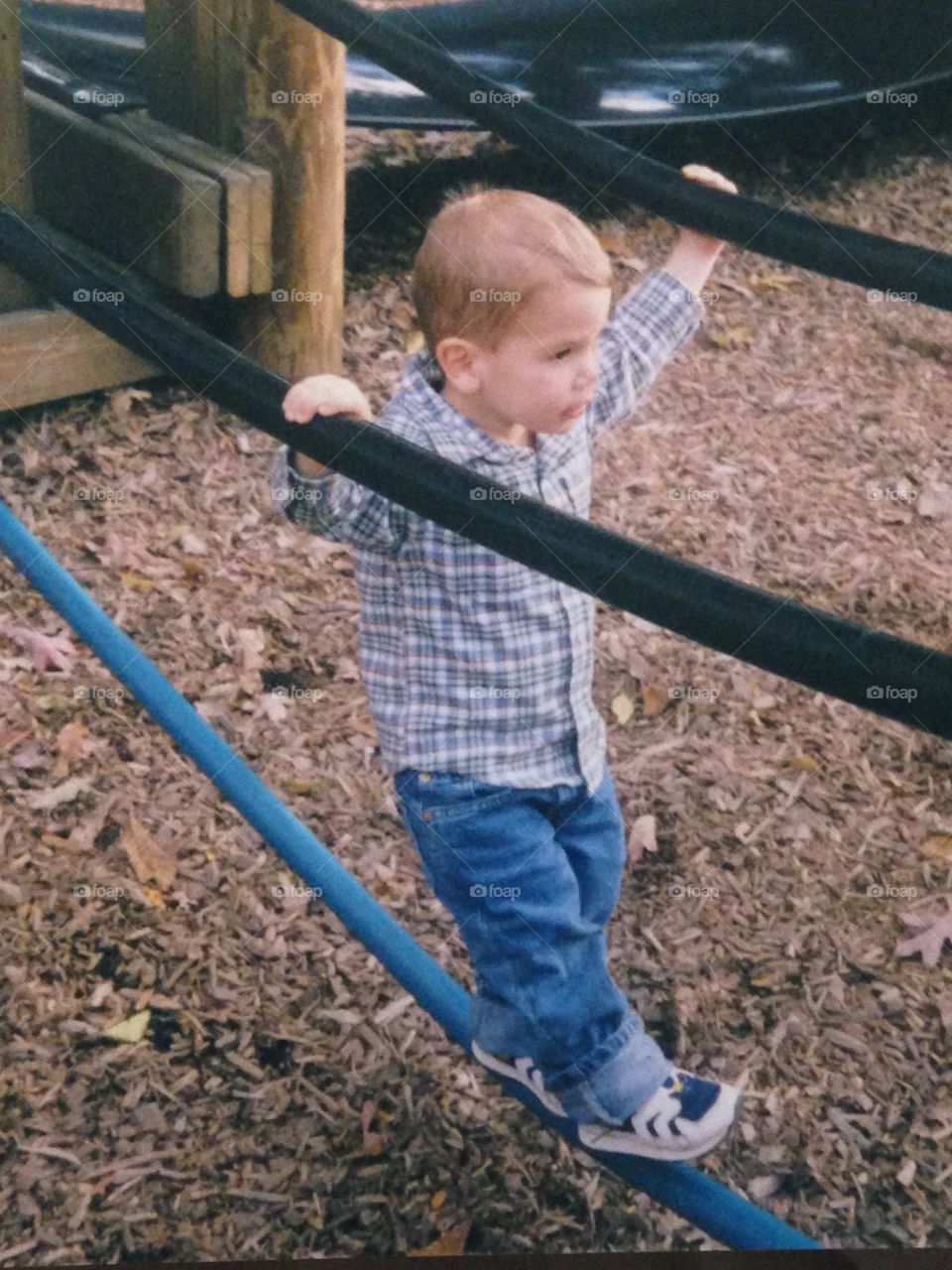Walking on ropes at the playground 