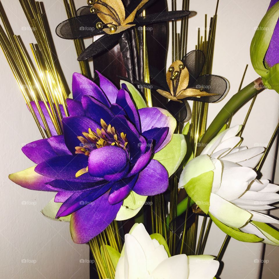 Auspicious lotus . The colours Purple, White & Gold are very auspicious, especially when put together is a beautiful bouquet. 