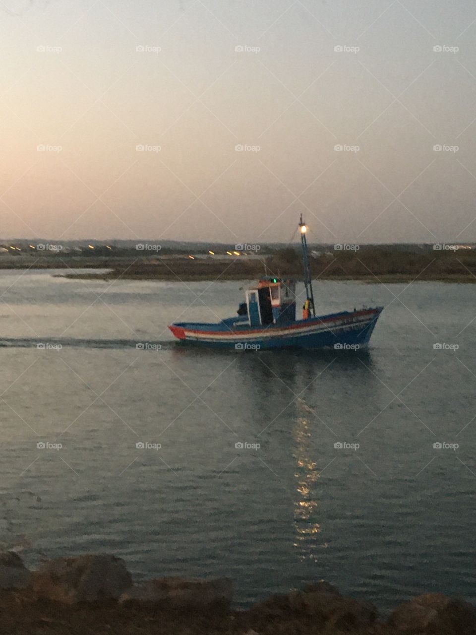 Fisherman boat in the evening light