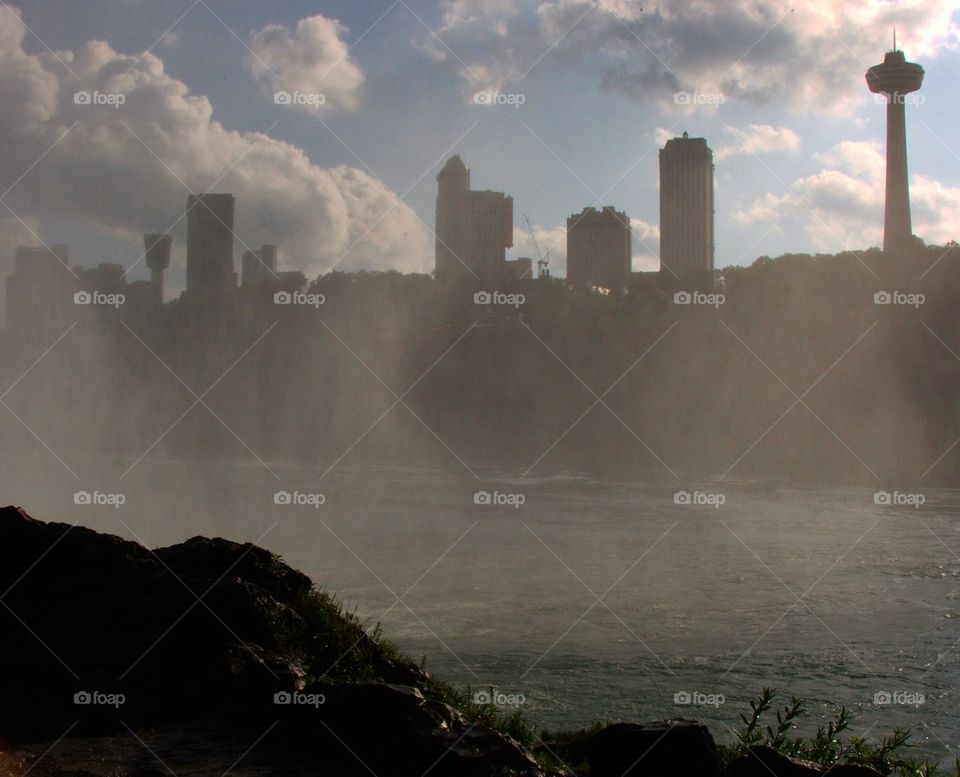 A view of the Canadian skyline through the mist of Niagara Falls 