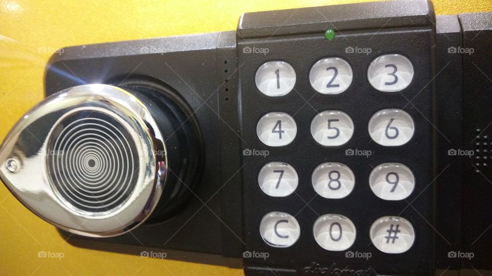 Black safe door and secure code buttons