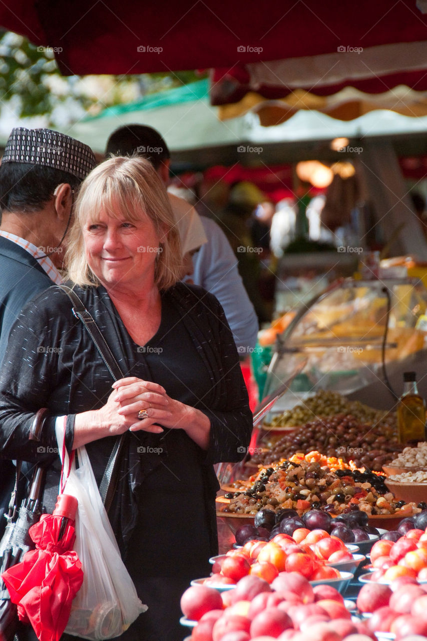 Woman shopping at the farmers market in France