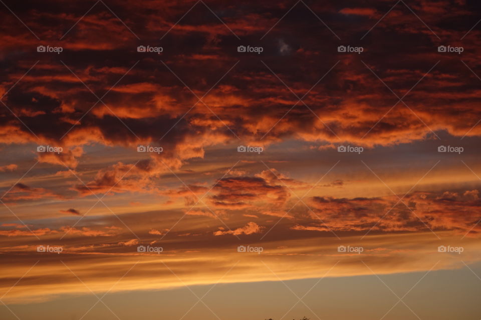 Low angle view of dramatic sky during sunset