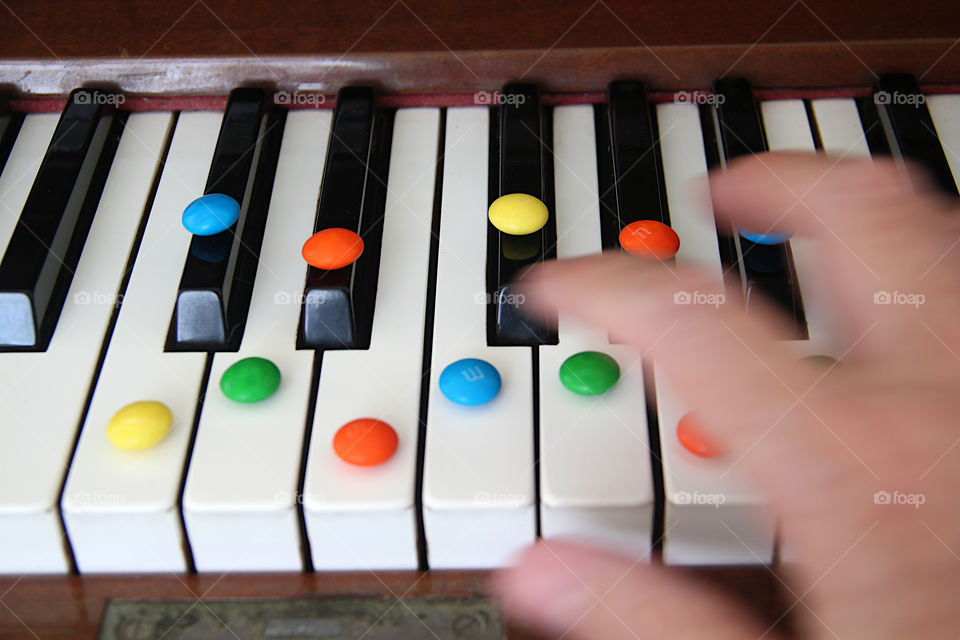 Playing piano and eating m&m's