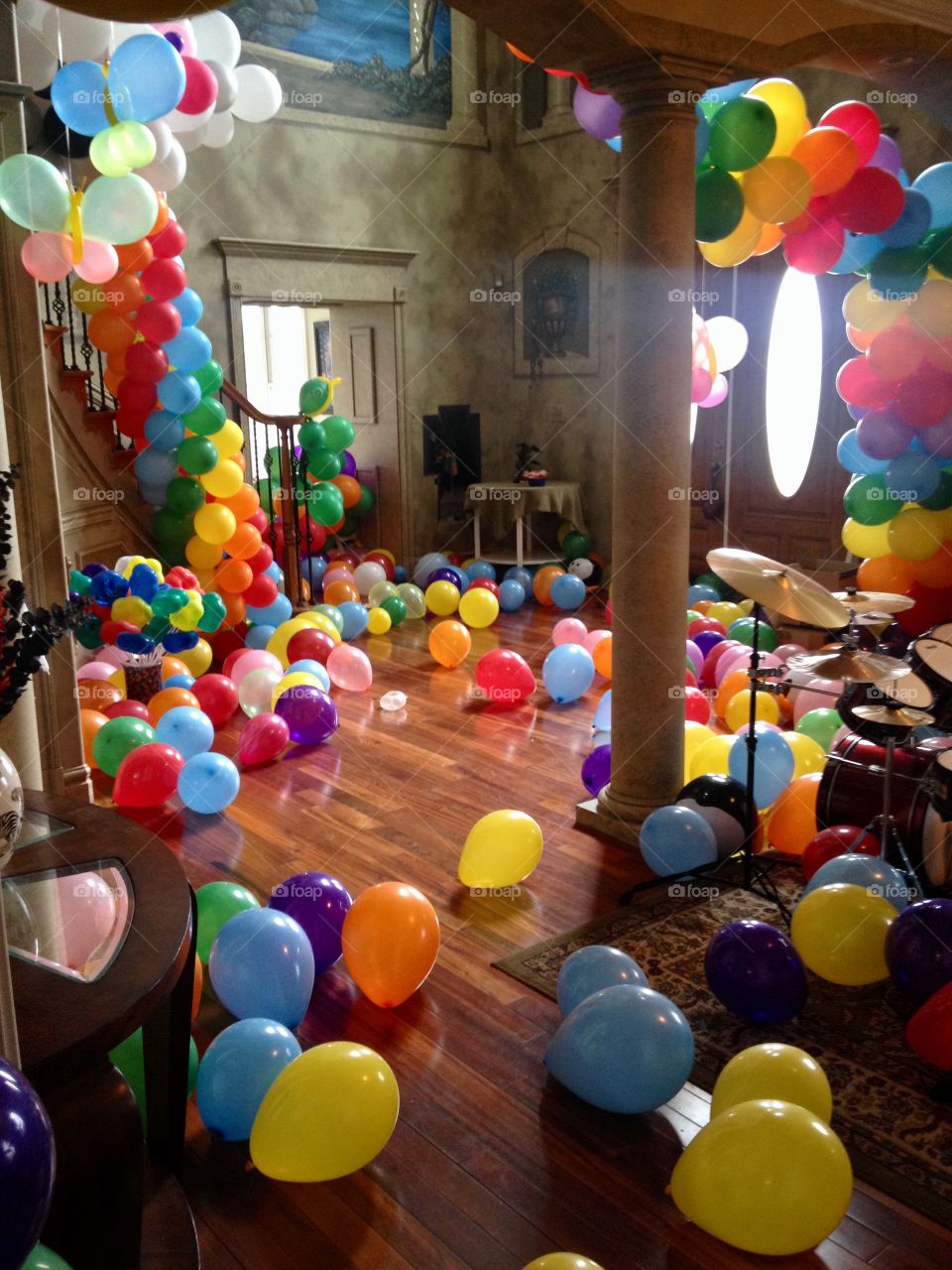 Room filled with colorful balloons for kids birthday party