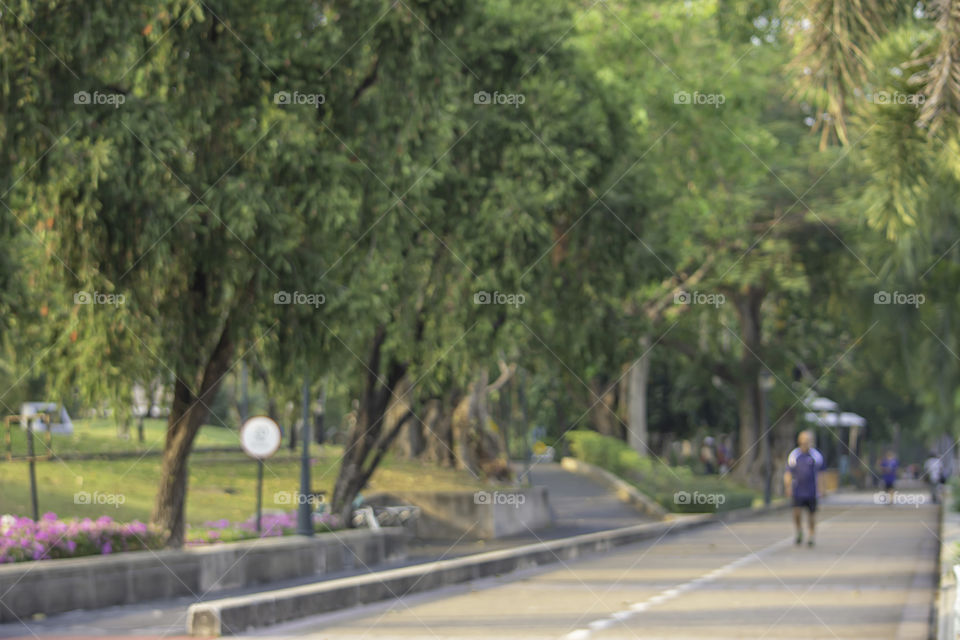 Blurry image people running exercise for health in the Benjakitti Park , Bangkok in Thailand.