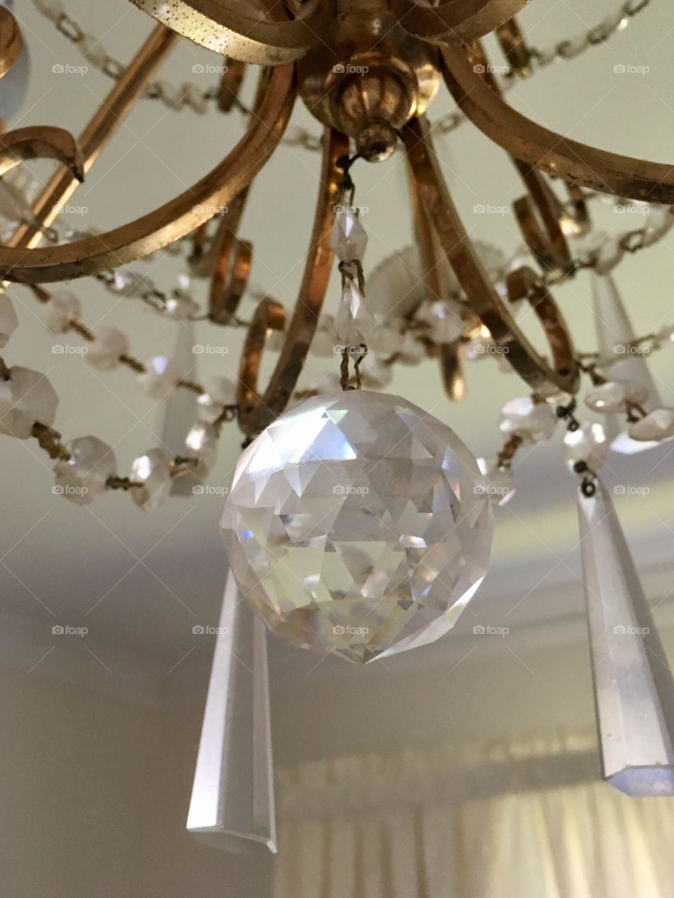 Crystal ball hanging from chandelier 