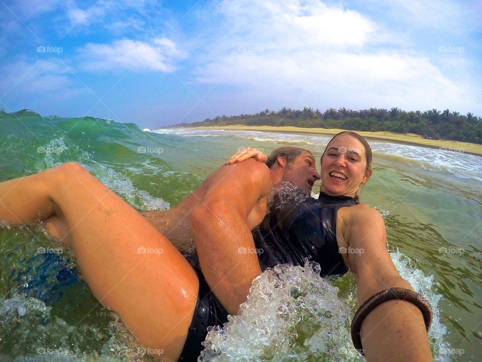 Couple bodysurfing together