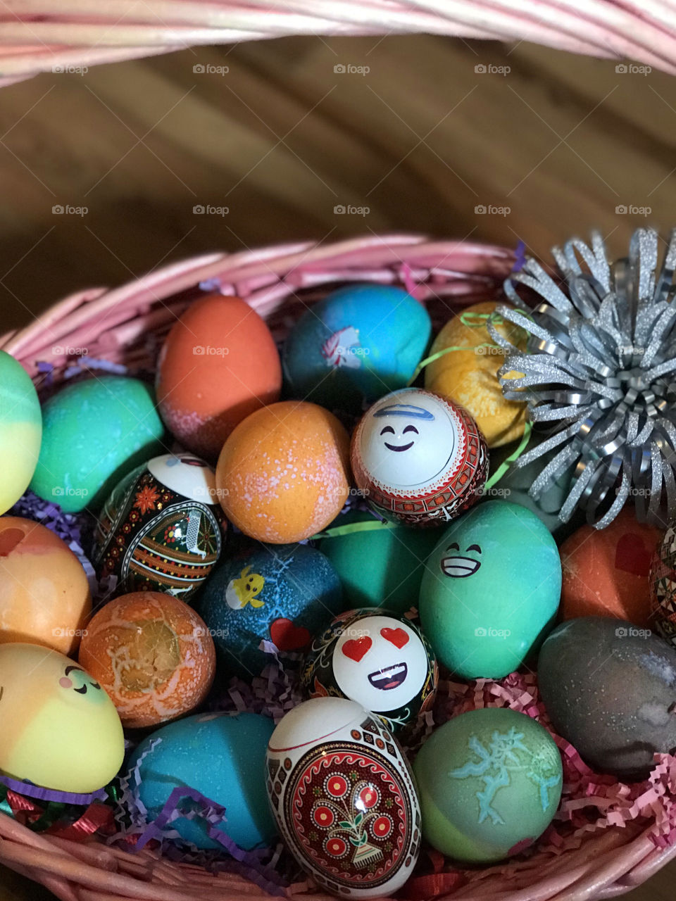 A pink wicker basketful of beautifully dyed and decorated eggs ‘eggs’pertly crafted by my daughters and niece while I was cooking an Easter feast! Great fun had by all!