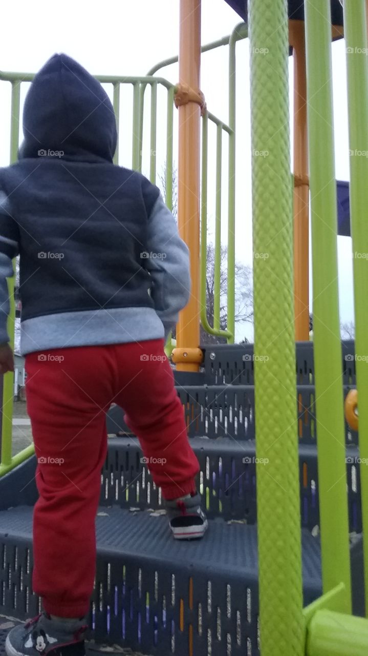 picture perfect. playing at the park and he's loving it.