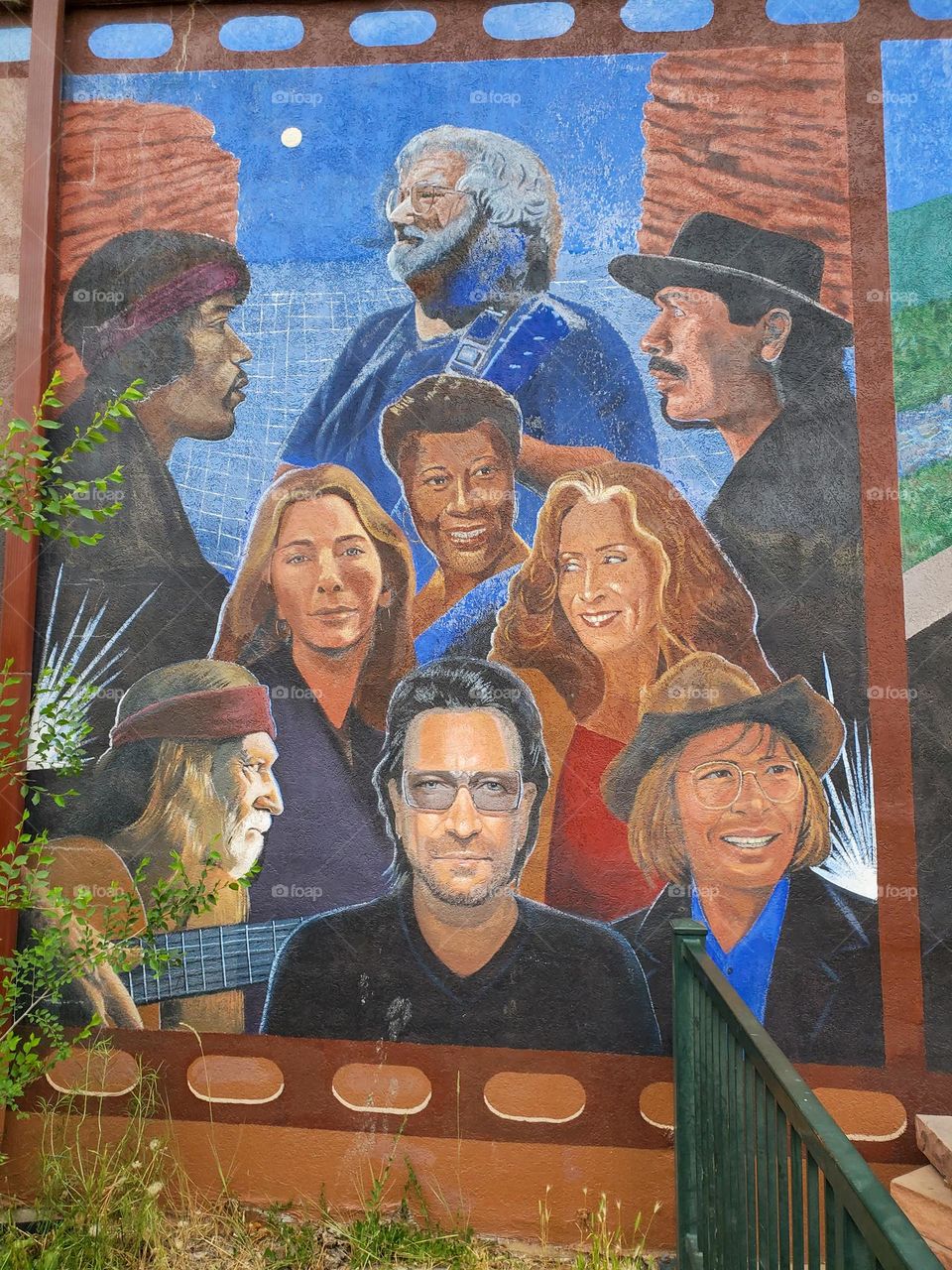 A mural depicts many famous musicians