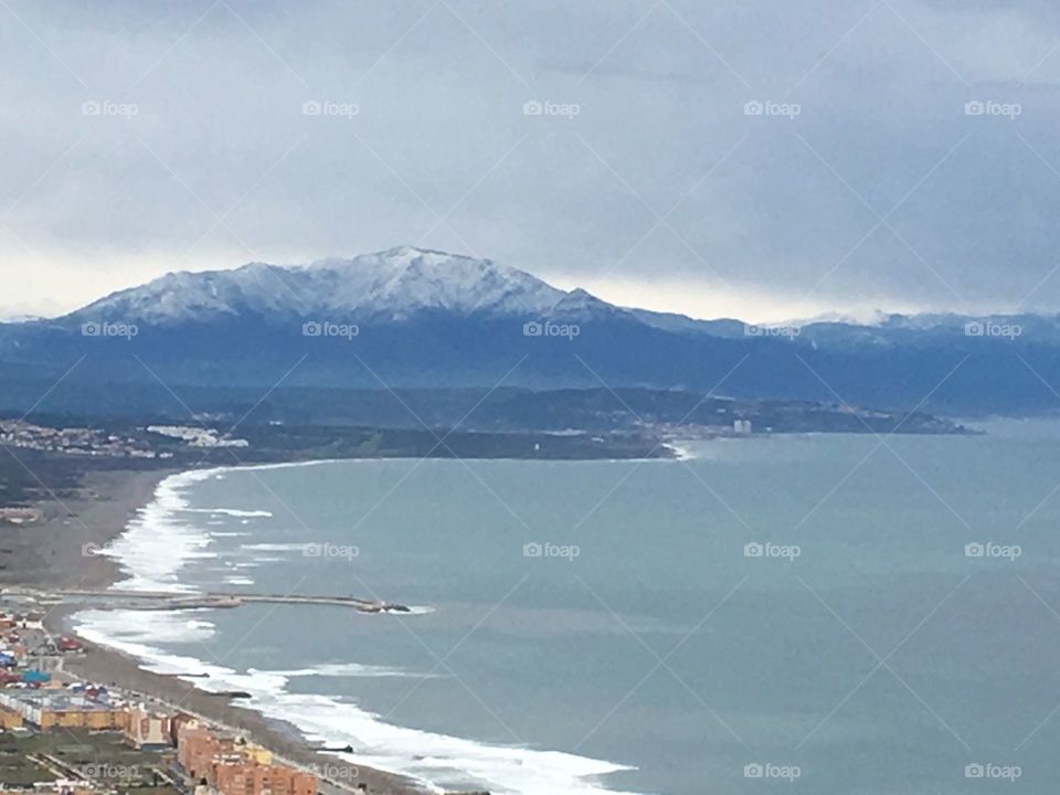 Views From Gibraltar to Spain. Tips of mountains covered with snow 
