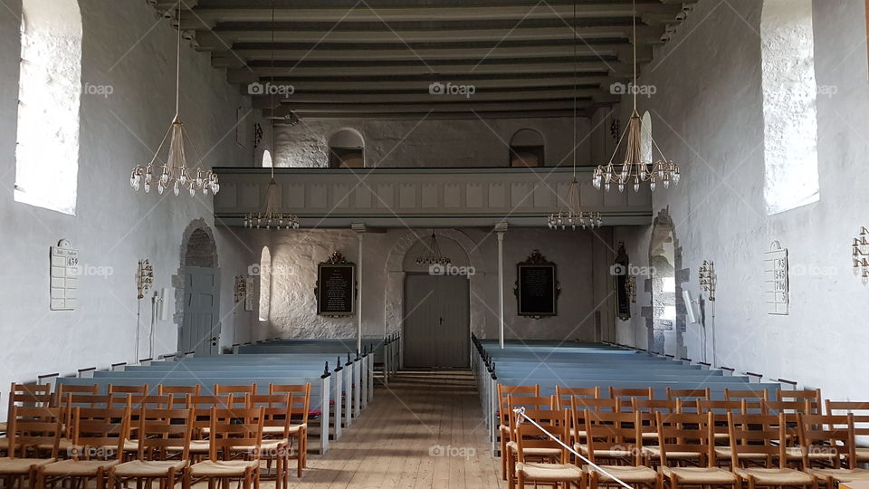 Austere interior of a Danish church in Bornholm, Denmark.