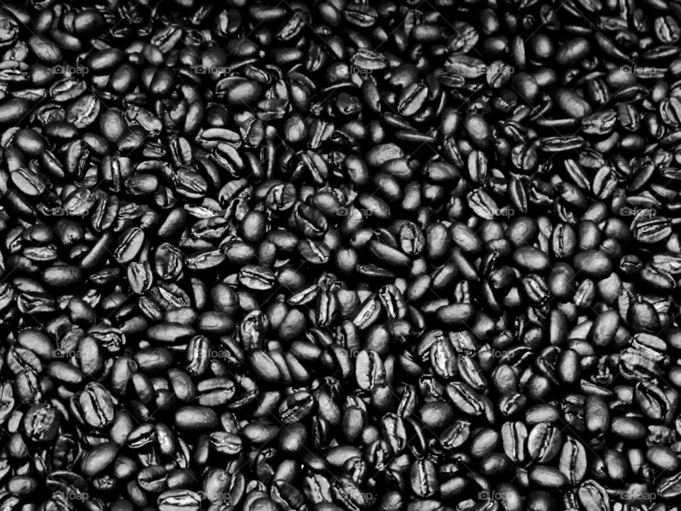 Closeup details of freshly roasted coffee beans. 