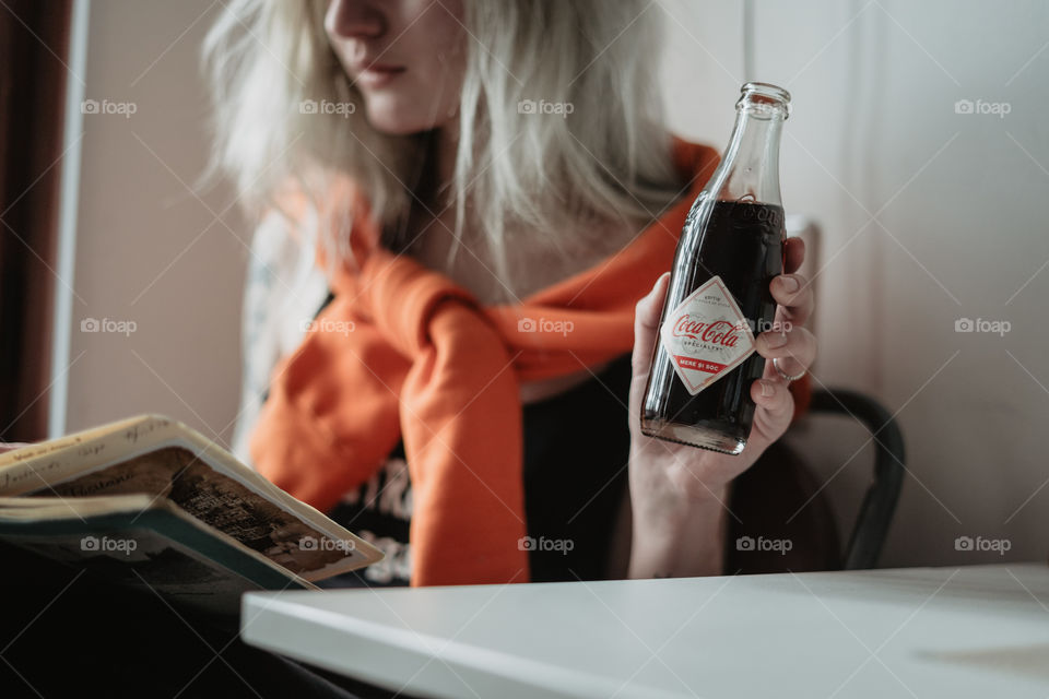 blond girl chilling with coca cola