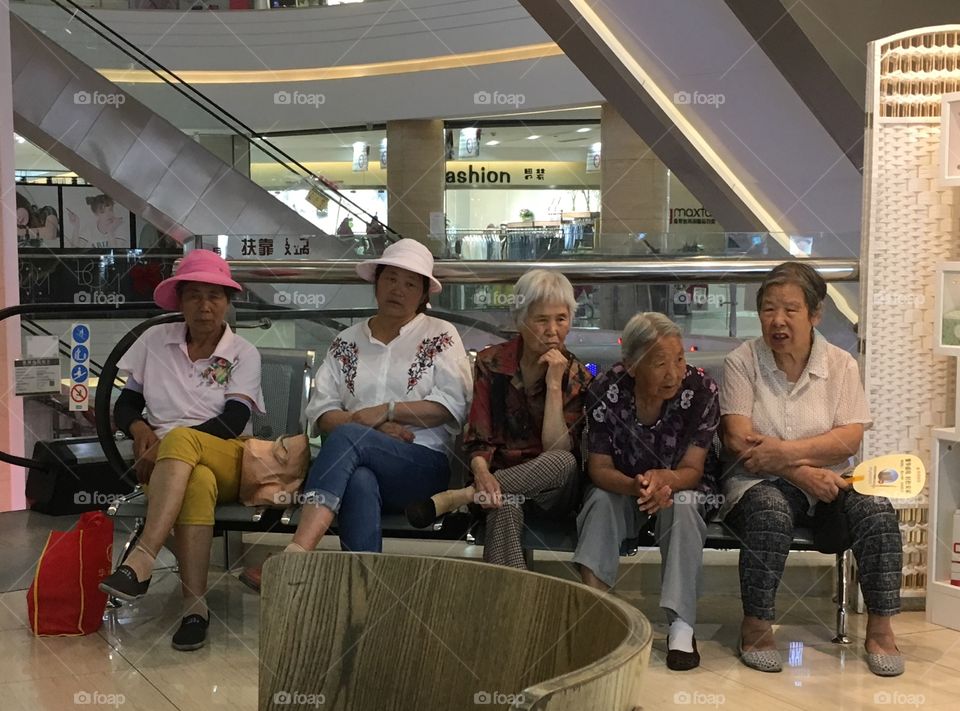 Chinese grandmas in a shopping mall
