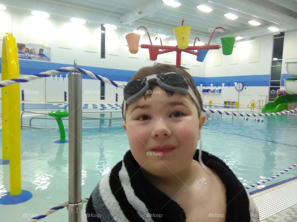 Boy standing in swimming club
