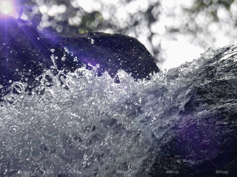 Early morning water flows from the river embarrassing the rocks and flashing water with joy while the sun peep out to see the beauty of it. ππ¦π