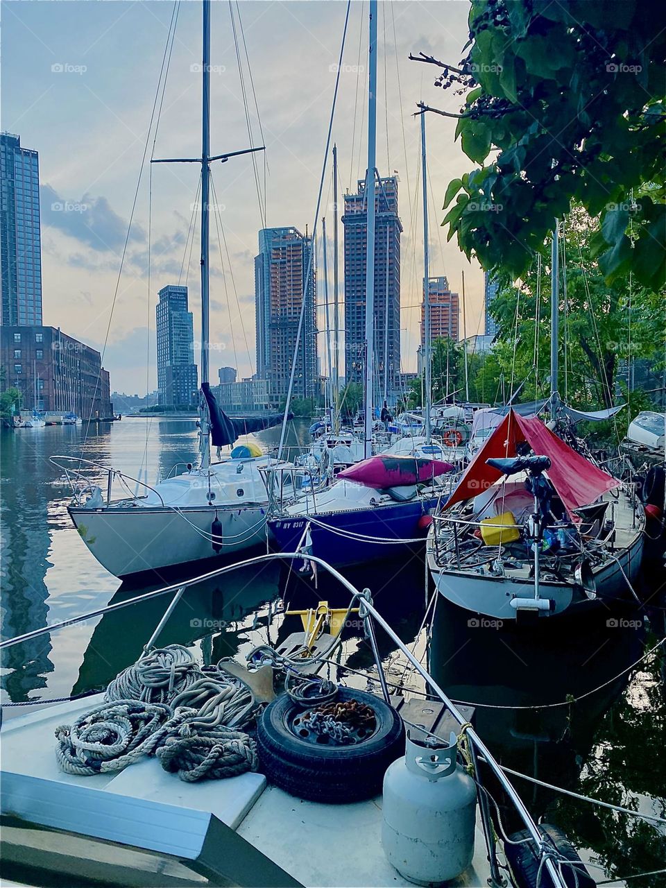The view directly from one of the boats here at “Newtown Creek” beneath the “Pulaski Bridge” in LIC, Queens onto the others is simply phenomenal. 2023. Hypnotic Productions