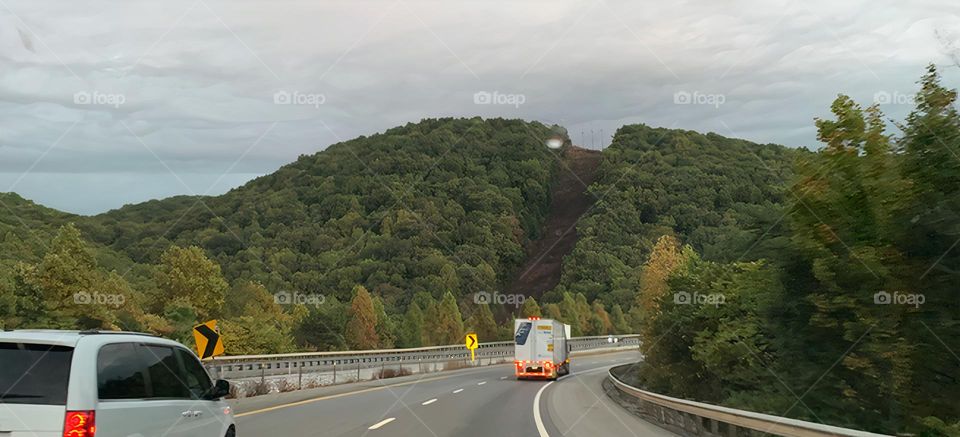 Mountain with a dirt sharp high road looking like a sky resort without snow on a drive travel on vacation in the beautiful Tennessee highway trip.