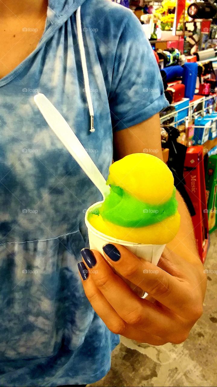 Italian ice of lemon and lime a perfect refreshment while walking the flea market in the summer heat