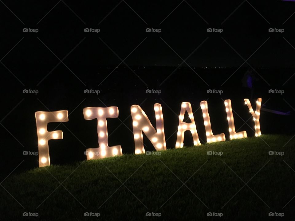 Lighted letters spelling finally