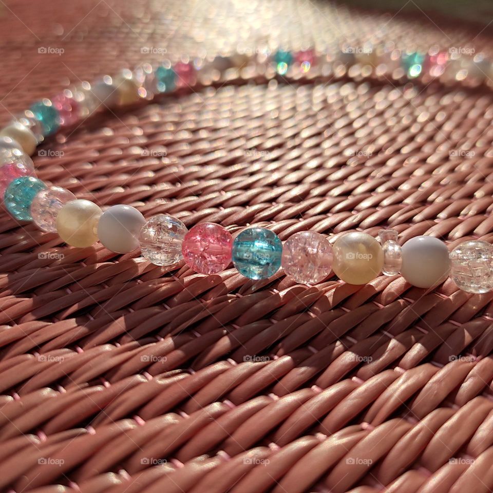 beads on mat making textured shadow.