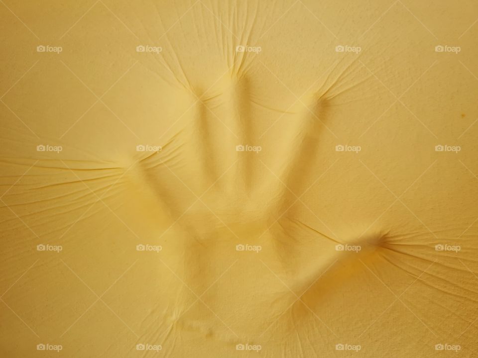 handprint on a memory foam pillow